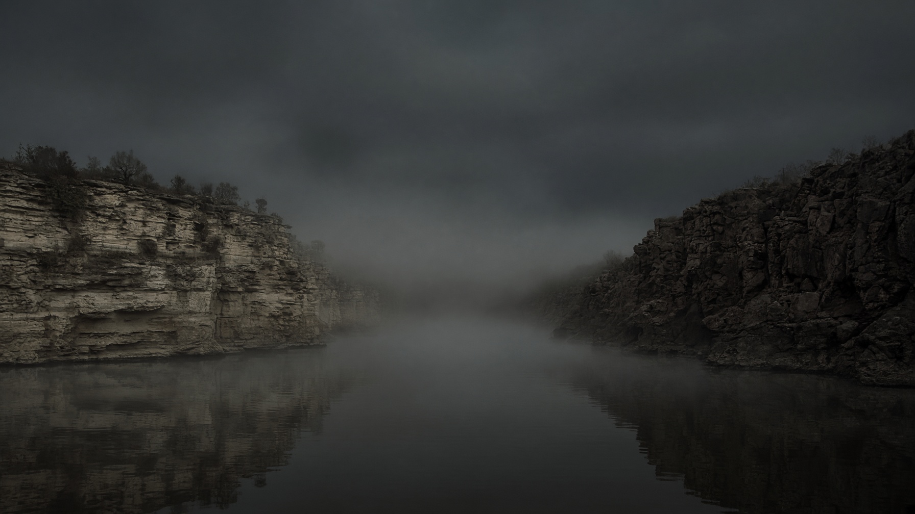 Two opposite shores with a channel of dark water between them.